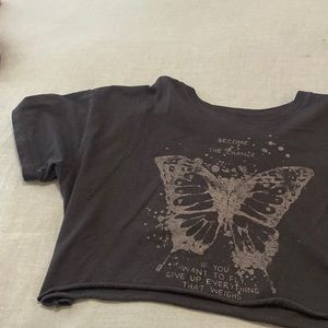 Black, flowy, cropped shirt.